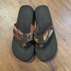 Yellow Box Flip Flops. Color: Brown snake skin design. Size: 10